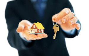 man holding house key 